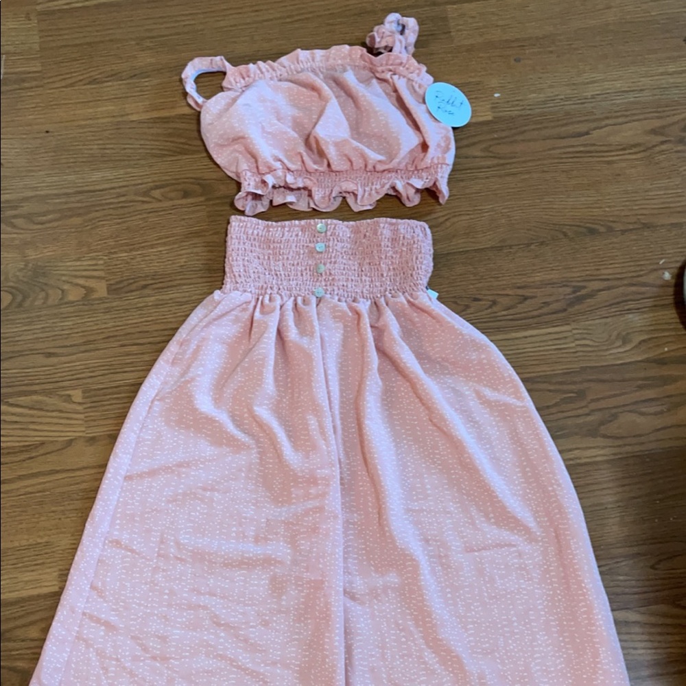 2 piece crop and skirt set. Skirt is midi length. Stretchy waistband